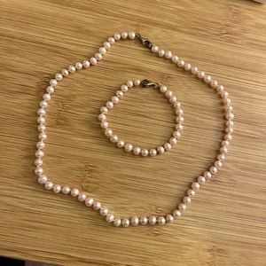 Matching pink faux pearl necklace and bracelet